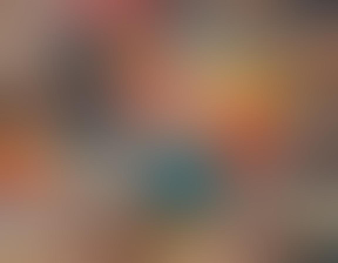 A visually engaging collage depicting a diverse group of people exploring erotic videos on different devices like tablets and laptops, with subtle hints of various genres displayed on screen. The background features warm, inviting colors to evoke a sense of intimacy and exploration. Include soft lighting and elements like popcorn and cozy pillows to enhance the casual, home-viewing experience. Add whimsical icons like hearts and play buttons floating around to emphasize the theme of finding quality content. super-realistic. warm colors. cozy atmosphere.